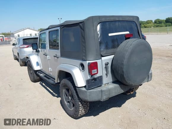 ✅ 2007 Jeep Wrangler Unlimited Sahara • VIN: 1J4GA591X7L101991 • Lot: 43233527. Listed on IAAI with 156,024 mi. Free auction sales archive from the USA and detailed vehicle history report at DreamBid. Image 3.