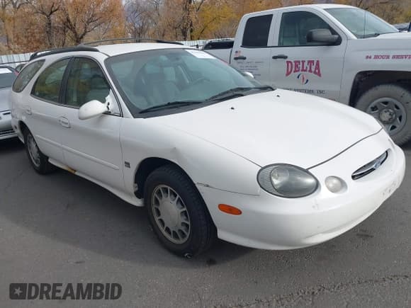 ✅ 1999 Ford Taurus SE • VIN: 1FAFP58S7XA309936 • Lot: 43703596. Wystawiony na IAAI z przebiegiem 221 934 mil. Bezpłatny archiwum sprzedaży aukcyjnych z USA i szczegółowy raport historii pojazdu na DreamBid. Zdjęcie 1.
