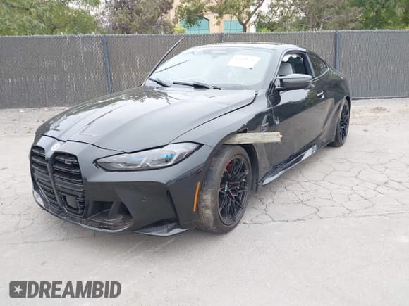 ✅ 2023 BMW M4 Competition xDrive • VIN: WBS43AZ07PCM99351 • Lot: 42643656. Listed on IAAI with 9,699 mi. Free auction sales archive from the USA and detailed vehicle history report at DreamBid. Image 2.
