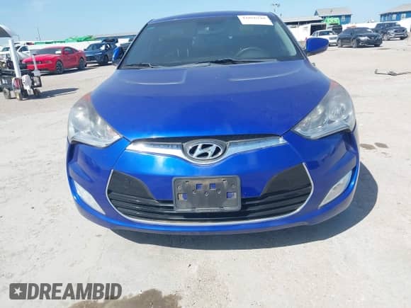 2012 Hyundai Veloster w/Gray Int z VIN KMHTC6AD5CU077688, wystawiony jako IAAI lot #42856328 z przebiegiem 54 849 mil mil oraz . Historia ofert i sprzedaży dostępna na DreamBid. Obrazek 6.