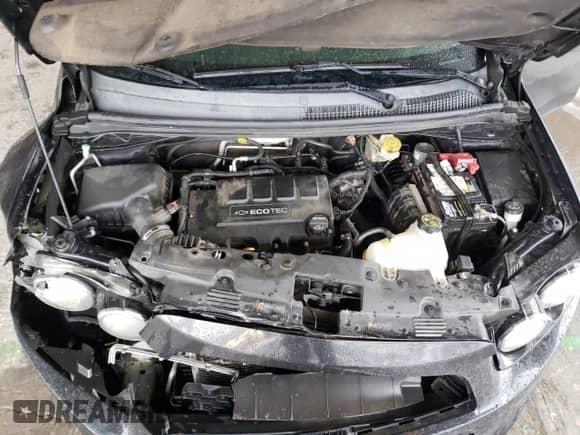 2015 Chevrolet Sonic RS z VIN 1G1JG5SB6F4138938, wystawiony jako Copart lot #77300543 z przebiegiem 156 011 mil mil oraz Szkoda całkowita • Salvage title. Historia ofert i sprzedaży dostępna na DreamBid. Obrazek 13.