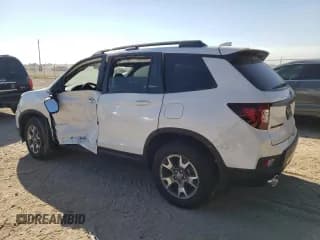 ✅ 2023 Honda Passport TrailSport • VIN: 5FNYF8H62PB019346 • Lot: 64276333. Listed on Copart with 1,453 mi. Free auction sales archive from the USA and detailed vehicle history report at DreamBid. Image 2.