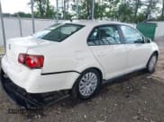 ✅ 2009 Volkswagen Jetta S • VIN: 3VWJM71K09M091585 • Lot: 43140304. Listed on IAAI with 239,628 mi. Free auction sales archive from the USA and detailed vehicle history report at DreamBid. Image 4.