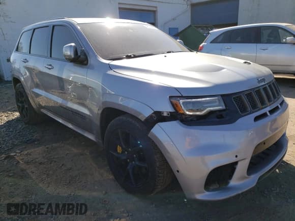 ✅ 2018 Jeep Grand Cherokee • VIN: NJ1454E • Lot: 48051693. Listed on Copart with 66,894 mi. Free auction sales archive from the USA and detailed vehicle history report at DreamBid. Image 4.