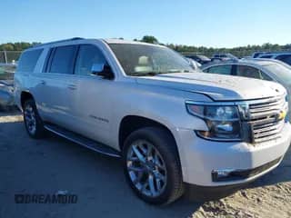 2019 Chevrolet Suburban Premier with VIN 1GNSCJKC0KR293658, listed as a IAAI auction lot 40563834 with 153,619 mi miles and . Bid and sale history available at DreamBid. Image 1.
