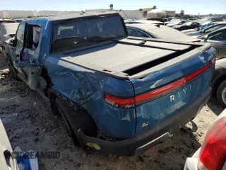 ✅ 2022 Rivian R1T Adventure • VIN: 7FCTGAAA4NN010881 • Lot: 58783584. Wystawiony na Copart z przebiegiem Nie podano. Bezpłatny archiwum sprzedaży aukcyjnych z USA i szczegółowy raport historii pojazdu na DreamBid. Zdjęcie 2.