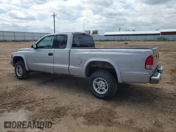 1999 Dodge Dakota SLT z VIN 1B7GG22X0XS268996, wystawiony jako Copart lot #58541515 z przebiegiem 189 899 mil mil oraz Czysty tytuł • Clean title. Historia ofert i sprzedaży dostępna na DreamBid. Obrazek 2.