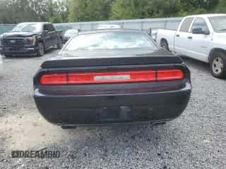 2013 Dodge Challenger SXT z VIN 2C3CDYAG5DH569623, wystawiony jako Copart lot #69090204 z przebiegiem 178 646 mil mil oraz Szkoda całkowita • Salvage title. Historia ofert i sprzedaży dostępna na DreamBid. Obrazek 6.