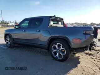 ✅ 2022 Rivian R1T Adventure • VIN: 7FCTGAAA6NN013037 • Lot: 75548964. Wystawiony na Copart z przebiegiem 8 877 mil. Bezpłatny archiwum sprzedaży aukcyjnych z USA i szczegółowy raport historii pojazdu na DreamBid. Zdjęcie 2.