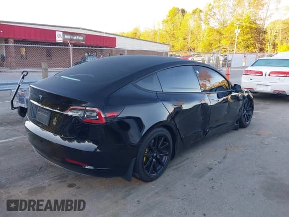 ✅ 2021 Tesla Model 3 Standard Range Plus • VIN: 5YJ3E1EA3MF915101 • Lot: 43580302. Listed on IAAI with 83,230 mi. Free auction sales archive from the USA and detailed vehicle history report at DreamBid. Image 4.