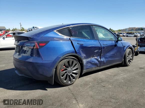 ✅ 2022 Tesla Model Y Performance • VIN: 7SAYGDEF8NF406574 • Lot: 80165595. Listed on Copart with 83,261 mi. Free auction sales archive from the USA and detailed vehicle history report at DreamBid. Image 3.
