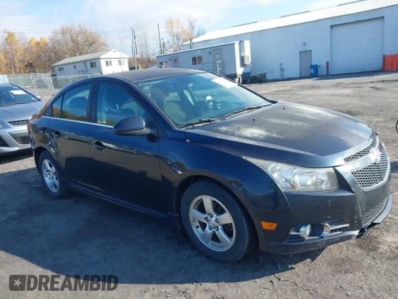 ✅ 2014 Chevrolet Cruze 1LT • VIN: 1G1PC5SB3E7363823 • Lot: 43610493. Listed on IAAI with 185,881 mi. Free auction sales archive from the USA and detailed vehicle history report at DreamBid. Image 1.