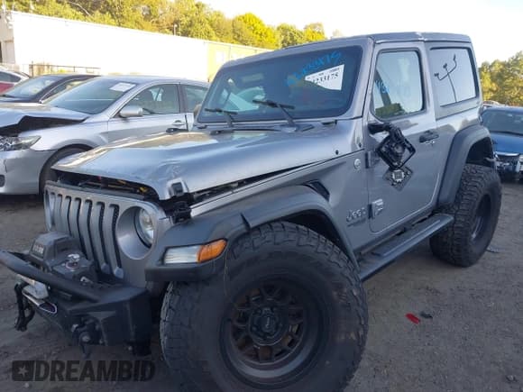 ✅ 2020 Jeep Wrangler Sport S • VIN: 1C4GJXAG1LW273787 • Лот: 43233175. Опубликован ранее на IAAI с пробегом 94 454 миль. Бесплатный доступ к архиву аукционных продаж из США и подробный отчёт об истории автомобиля на DreamBid. Изображение 2.