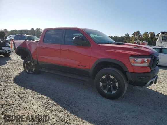2020 Ram 1500 Rebel с VIN 1C6RRELT4LN320355, выставлен на аукционе Copart как лот 78524884 с пробегом 67 616 миль миль и Списание • Salvage title. История ставок и продаж доступна на DreamBid. Изображение 4.