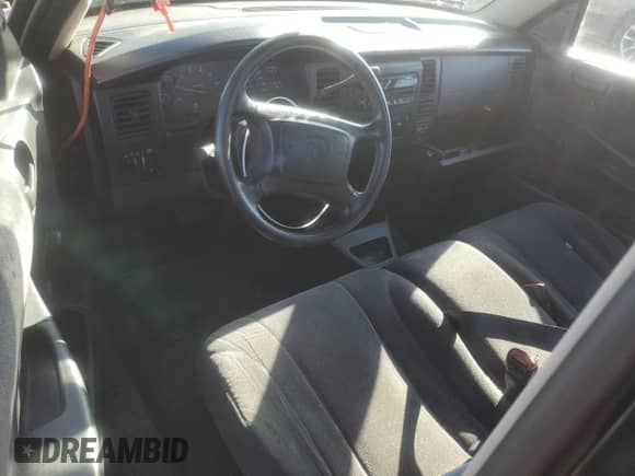 2002 Dodge Dakota Sport z VIN 1B7FL36XX2S643163, wystawiony jako Copart lot #80643184 z przebiegiem 230 990 mil mil oraz Nie do naprawy • Non repairable. Historia ofert i sprzedaży dostępna na DreamBid. Obrazek 8.