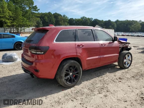 ✅ 2015 Jeep Grand Cherokee SRT • VIN: 1C4RJFDJ0LC348569 • Лот: 68952885. Опубликован ранее на Copart с пробегом 70 971 миль. Бесплатный доступ к архиву аукционных продаж из США и подробный отчёт об истории автомобиля на DreamBid. Изображение 3.