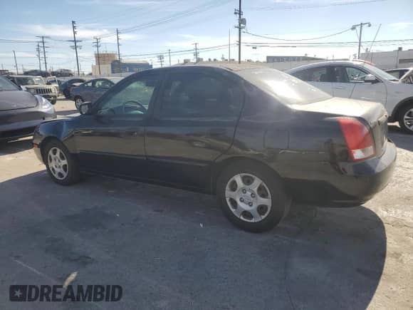 2003 Hyundai Elantra GLS with VIN KMHDN45D63U675382, listed as a Copart auction lot 76012974 with 140,218 mi miles and Salvage title. Bid and sale history available at DreamBid. Image 2.