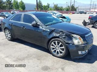 ✅ 2009 Cadillac CTS RWD • VIN: 1G6DV57V690169781 • Lot: 42831076. Listed on IAAI with 154,568 mi. Free auction sales archive from the USA and detailed vehicle history report at DreamBid. Image 1.