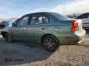 2004 Hyundai Accent GL z VIN KMHCG45C44U531828, wystawiony jako Copart lot #86428134 z przebiegiem 92 054 mil mil oraz Szkoda całkowita • Salvage title. Historia ofert i sprzedaży dostępna na DreamBid. Obrazek 2.