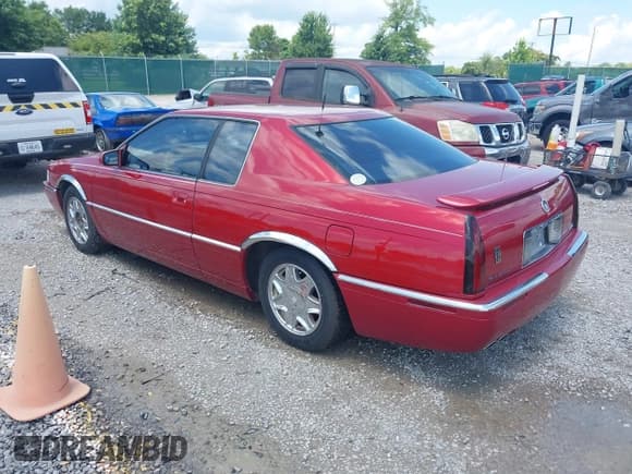 ✅ 2001 Cadillac Eldorado ESC • VIN: 1G6EL12Y31B107932 • Lot: 42723296. Wystawiony na IAAI z przebiegiem 152 482 mil. Bezpłatny archiwum sprzedaży aukcyjnych z USA i szczegółowy raport historii pojazdu na DreamBid. Zdjęcie 3.