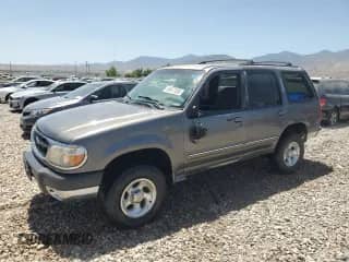1999 Ford Explorer XLT with VIN 1FMZU34E9XZA45930, listed as a Copart auction lot 60877285 with 210,255 mi miles and Salvage title. Bid and sale history available at DreamBid. Image 1.
