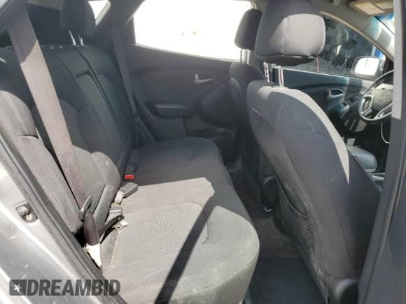 2013 Hyundai Tucson GL z VIN KM8JT3ACXDU556283, wystawiony jako Copart lot #64970585 z przebiegiem 227 610 mil mil oraz Szkoda całkowita • Salvage title. Historia ofert i sprzedaży dostępna na DreamBid. Obrazek 11.