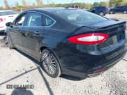 ✅ 2016 Ford Fusion Titanium • VIN: 3FA6P0D95GR272235 • Lot: 43354822. Listed on IAAI with 145,520 mi. Free auction sales archive from the USA and detailed vehicle history report at DreamBid. Image 3.