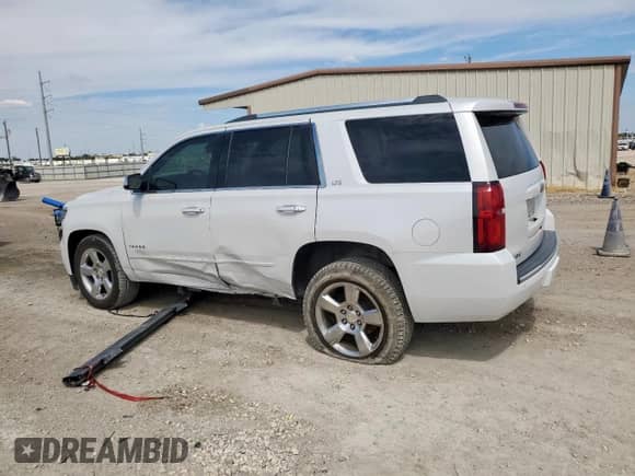 2016 Chevrolet Tahoe LTZ с VIN 1GNSKCKC6GR264493, выставлен на аукционе Copart как лот 84283015 с пробегом 142 412 миль миль и Списание • Salvage title. История ставок и продаж доступна на DreamBid. Изображение 2.