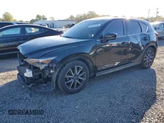 ✅ 2018 Mazda CX-5 Grand Touring • VIN: JM3KFBDM9J0431087 • Lot: 87479155. Wystawiony na Copart z przebiegiem 100 826 mil. Bezpłatny archiwum sprzedaży aukcyjnych z USA i szczegółowy raport historii pojazdu na DreamBid. Zdjęcie 1.