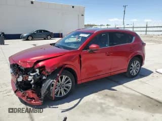 ✅ 2023 Mazda CX-5 Signature • VIN: JM3KFBXY7P0136013 • Lot: 56436355. Listed on Copart with 31,575 mi. Free auction sales archive from the USA and detailed vehicle history report at DreamBid. Image 1.