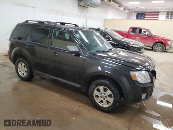 ✅ 2011 Mercury Mariner • VIN: 4M2CN9BG9BKJ06722 • Lot: 62014585. Listed on Copart with 242,214 mi. Free auction sales archive from the USA and detailed vehicle history report at DreamBid. Image 4.