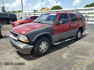 ✅ 2000 GMC Jimmy SLE • VIN: 1GKCS13WXY2357087 • Лот: 60999105. Опубликован ранее на Copart с пробегом 90 017 миль. Бесплатный доступ к архиву аукционных продаж из США и подробный отчёт об истории автомобиля на DreamBid. Изображение 1.