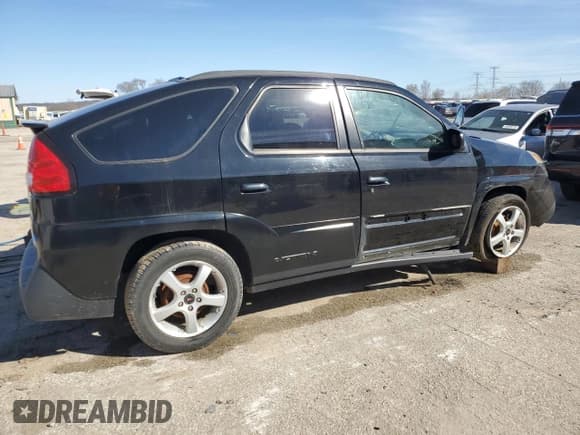 ✅ 2003 Pontiac Aztek • VIN: 3G7DA03E73S556503 • Lot: 49492825. Listed on Copart with 142,654 mi. Free auction sales archive from the USA and detailed vehicle history report at DreamBid. Image 3.