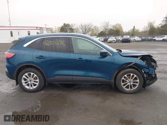 ✅ 2020 Ford Escape SE • VIN: 1FMCU9G60LUA89528 • Lot: 42008698. Listed on IAAI with 75,056 mi. Free auction sales archive from the USA and detailed vehicle history report at DreamBid. Image 13.