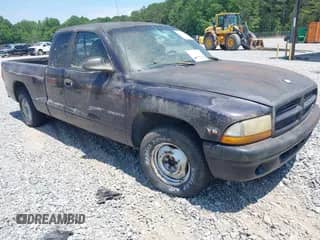 1998 Dodge Dakota SLT with VIN 1B7GL22X3WS569885, listed as a IAAI auction lot 42128994 with 129,370 mi miles and . Bid and sale history available at DreamBid. Image 1.
