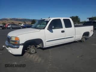 2004 GMC Sierra 1500 SLT with VIN 1GTEK19T64E137004, listed as a Copart auction lot 66133455 with 232,841 mi miles and Salvage title. Bid and sale history available at DreamBid. Image 1.