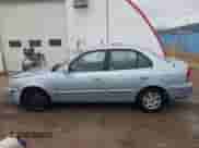 2003 Hyundai Accent GL z VIN KMHCG45C43U465523, wystawiony jako IAAI lot #40883056 z przebiegiem 95 770 mil mil oraz . Historia ofert i sprzedaży dostępna na DreamBid. Obrazek 14.