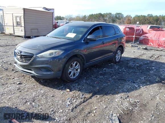 ✅ 2015 Mazda CX-9 Sport • VIN: JM3TB3BA4F0450894 • Lot: 43796975. Wystawiony na IAAI z przebiegiem 178 994 mil. Bezpłatny archiwum sprzedaży aukcyjnych z USA i szczegółowy raport historii pojazdu na DreamBid. Zdjęcie 2.