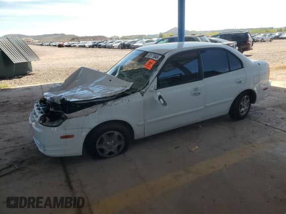 2005 Hyundai Accent GLS z VIN KMHCG45C65U661496, wystawiony jako Copart lot #55171545 z przebiegiem 137 514 mil mil oraz Szkoda całkowita • Salvage title. Historia ofert i sprzedaży dostępna na DreamBid. Obrazek 1.