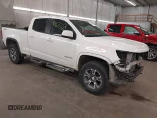 2015 Chevrolet Colorado 4WD Z71 z VIN 1GCGTCE36F1265552, wystawiony jako IAAI lot #42677201 z przebiegiem 168 895 mil mil oraz . Historia ofert i sprzedaży dostępna na DreamBid. Obrazek 1.