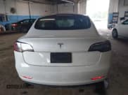 ✅ 2021 Tesla Model 3 Standard Range Plus • VIN: 5YJ3E1EA6MF009508 • Lot: 43296972. Listed on IAAI with 95,539 mi. Free auction sales archive from the USA and detailed vehicle history report at DreamBid. Image 16.