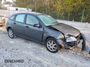 ✅ 2005 Ford Focus S • VIN: 3FAFP37N45R151980 • Lot: 86819635. Listed on Copart with 99,173 mi. Free auction sales archive from the USA and detailed vehicle history report at DreamBid. Image 4.