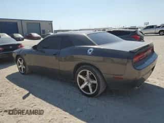 2013 Dodge Challenger SXT z VIN 2C3CDYAGXDH591441, wystawiony jako Copart lot #71681964 z przebiegiem 174 043 mil mil oraz Czysty tytuł • Clean title. Historia ofert i sprzedaży dostępna na DreamBid. Obrazek 2.