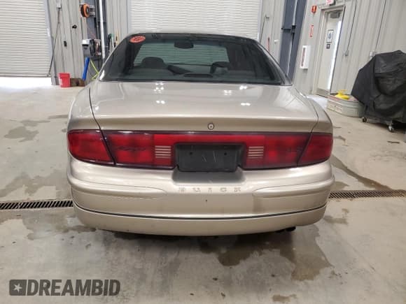 ✅ 2003 Buick Regal LS • VIN: 2G4WB52K931204753 • Lot: 64142365. Listed on Copart with 118,581 mi. Free auction sales archive from the USA and detailed vehicle history report at DreamBid. Image 6.