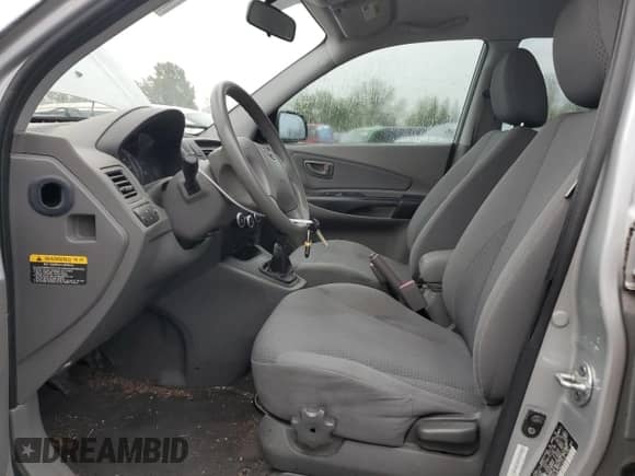 2009 Hyundai Tucson GLS z VIN KM8JM12B79U113216, wystawiony jako Copart lot #75191434 z przebiegiem 132 677 mil mil oraz Szkoda całkowita • Salvage title. Historia ofert i sprzedaży dostępna na DreamBid. Obrazek 7.