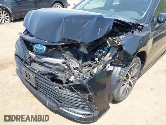 2022 Toyota Camry Hybrid XLE with VIN 4T1F31AK5NU585743, listed as a IAAI auction lot 42481083 with 44,161 mi miles and . Bid and sale history available at DreamBid. Image 6.