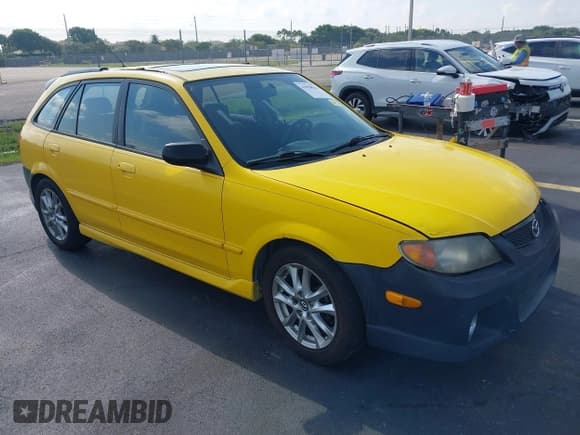 ✅ 2002 Mazda Protege • VIN: JM1BJ245321542536 • Lot: 43058514. Listed on IAAI with 170,774 mi. Free auction sales archive from the USA and detailed vehicle history report at DreamBid. Image 1.