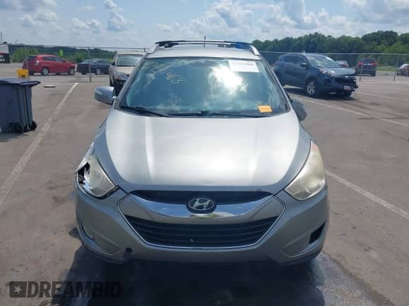 ✅ 2011 Hyundai Tucson Limited • VIN: KM8JUCACXBU213998 • Lot: 42937468. Listed on IAAI with 199,789 mi. Free auction sales archive from the USA and detailed vehicle history report at DreamBid. Image 12.