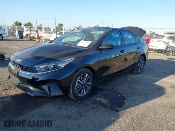 ✅ 2023 Kia Forte LXS • VIN: 3KPF24AD1PE567459 • Lot: 43176868. Listed on IAAI with 57,313 mi. Free auction sales archive from the USA and detailed vehicle history report at DreamBid. Image 2.