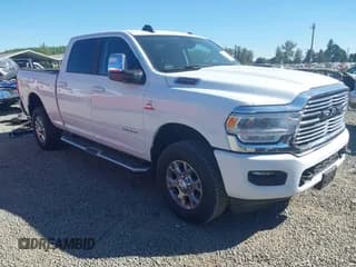 ✅ 2024 Ram 2500 Laramie • VIN: 3C6UR5FL7RG282210 • Lot: 42827990. Listed on IAAI with 18,704 mi. Free auction sales archive from the USA and detailed vehicle history report at DreamBid. Image 1.